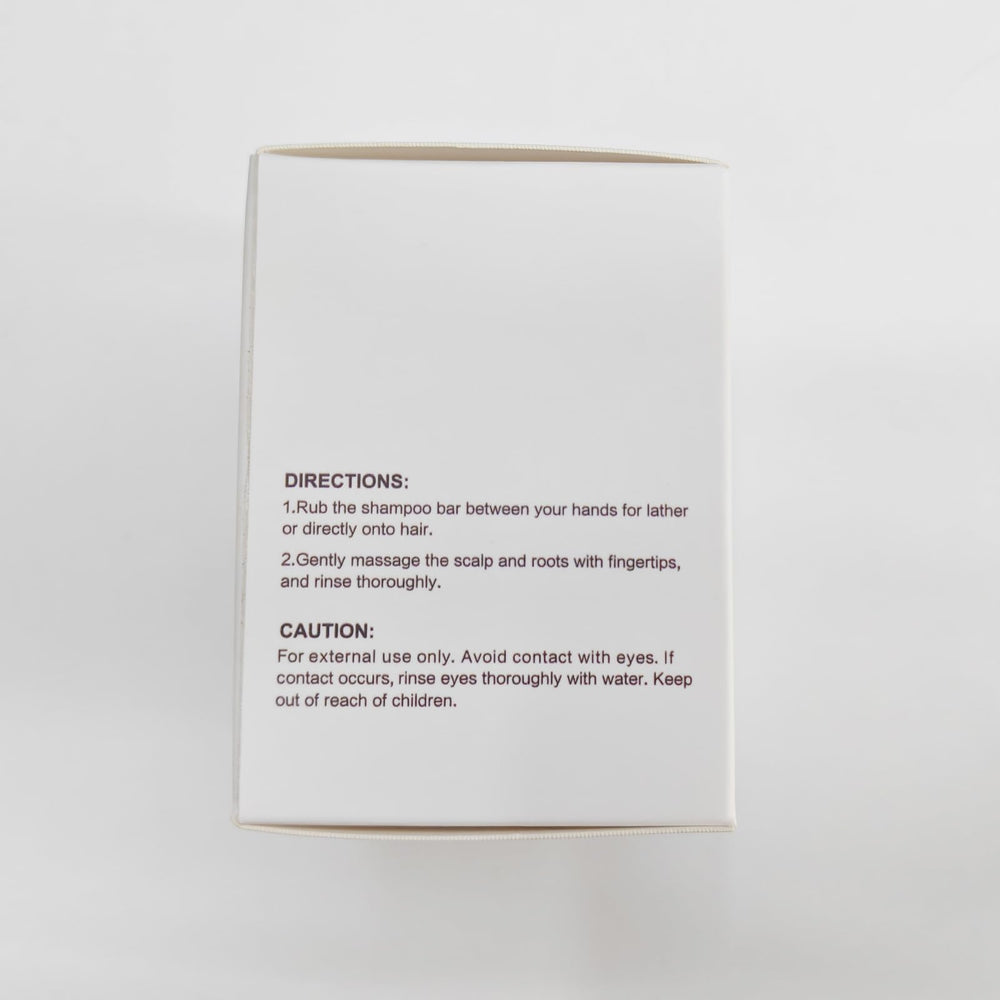 LIYALAN shampoo bar held in hand, ready for direct application.