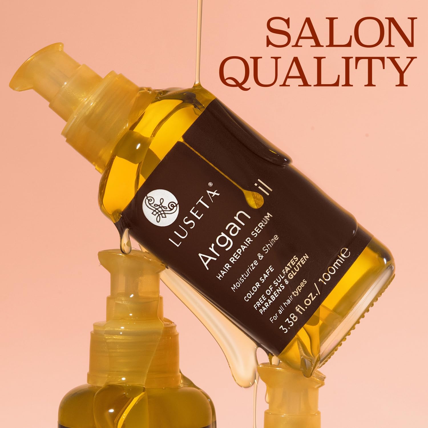 L LUSETA serum dropper applying oil to dry hair for repair.