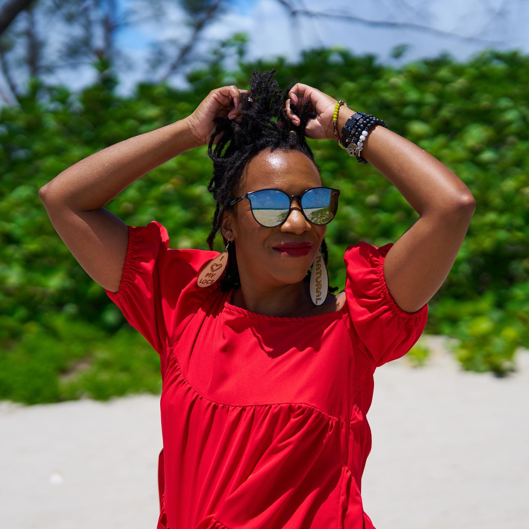 Locsanity Grapefruit Coconut & Lime mist spritz on braided hair.