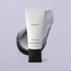 LolaVie Exfoliate & Detox scalp scrub in hand highlights charcoal exfoliation benefits.