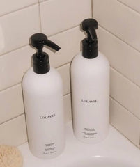 LolaVie Mega Restorative Shampoo and Conditioner bottle boosts hydration and strength.