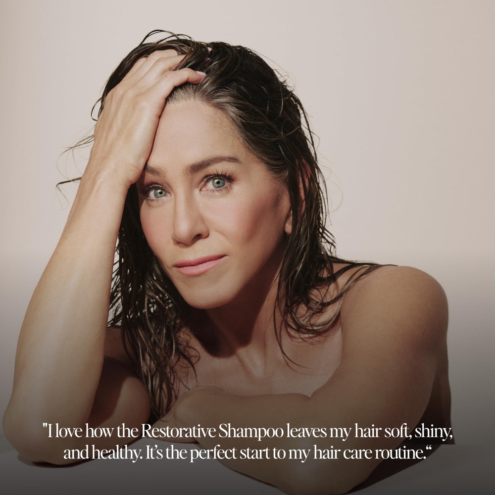 Applying LolaVie Restorative Shampoo on wet hair from roots to tips.
