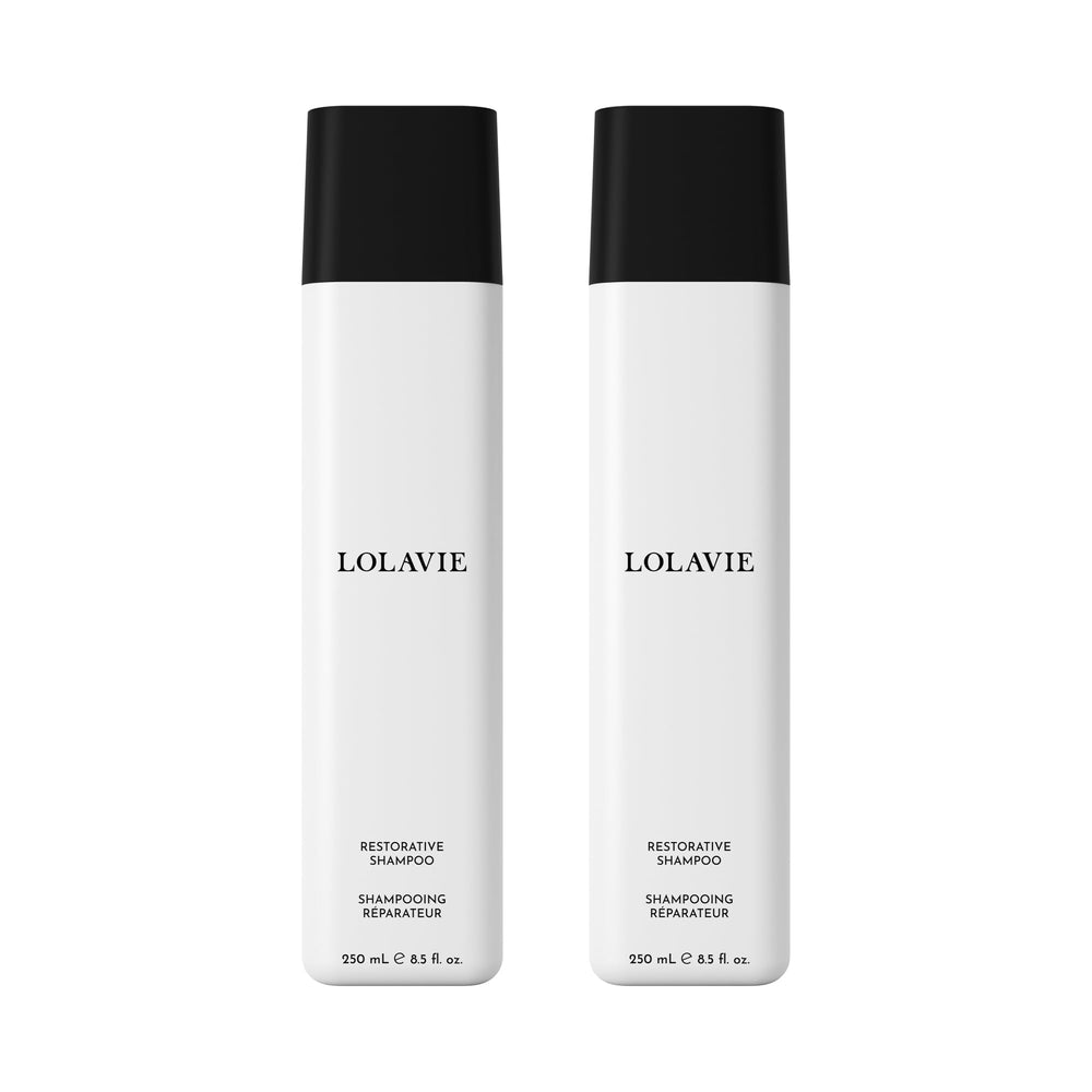 Lolavie Restorative Shampoo bottle on bathroom shelf suggesting healthier-looking hair.