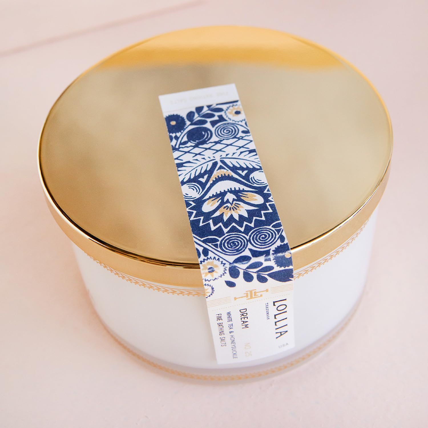 LOLLIA Dream Bath Salt being poured into a warm tub for a fragrant soak