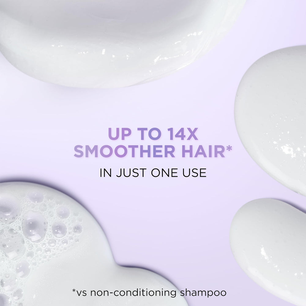 Applying the glossing glaze through damp hair for even distribution.