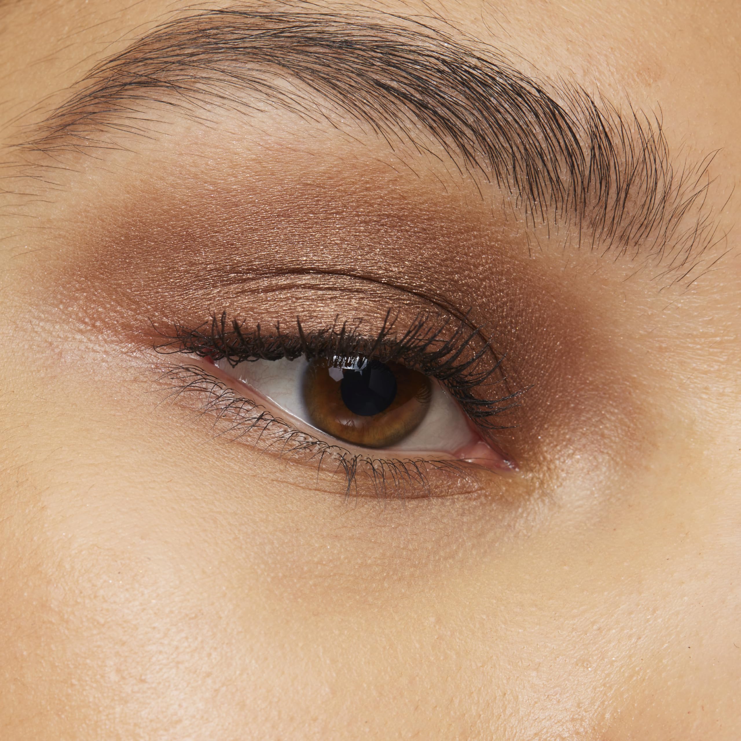 L'Oreal Paris Le Shadow Stick shimmering champagne swatch, adds subtle glow.