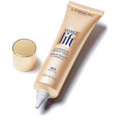 Product in hand with glow, ready for easy daily application by L'Oreal Paris Visible Lift Luminous Serum Tint.