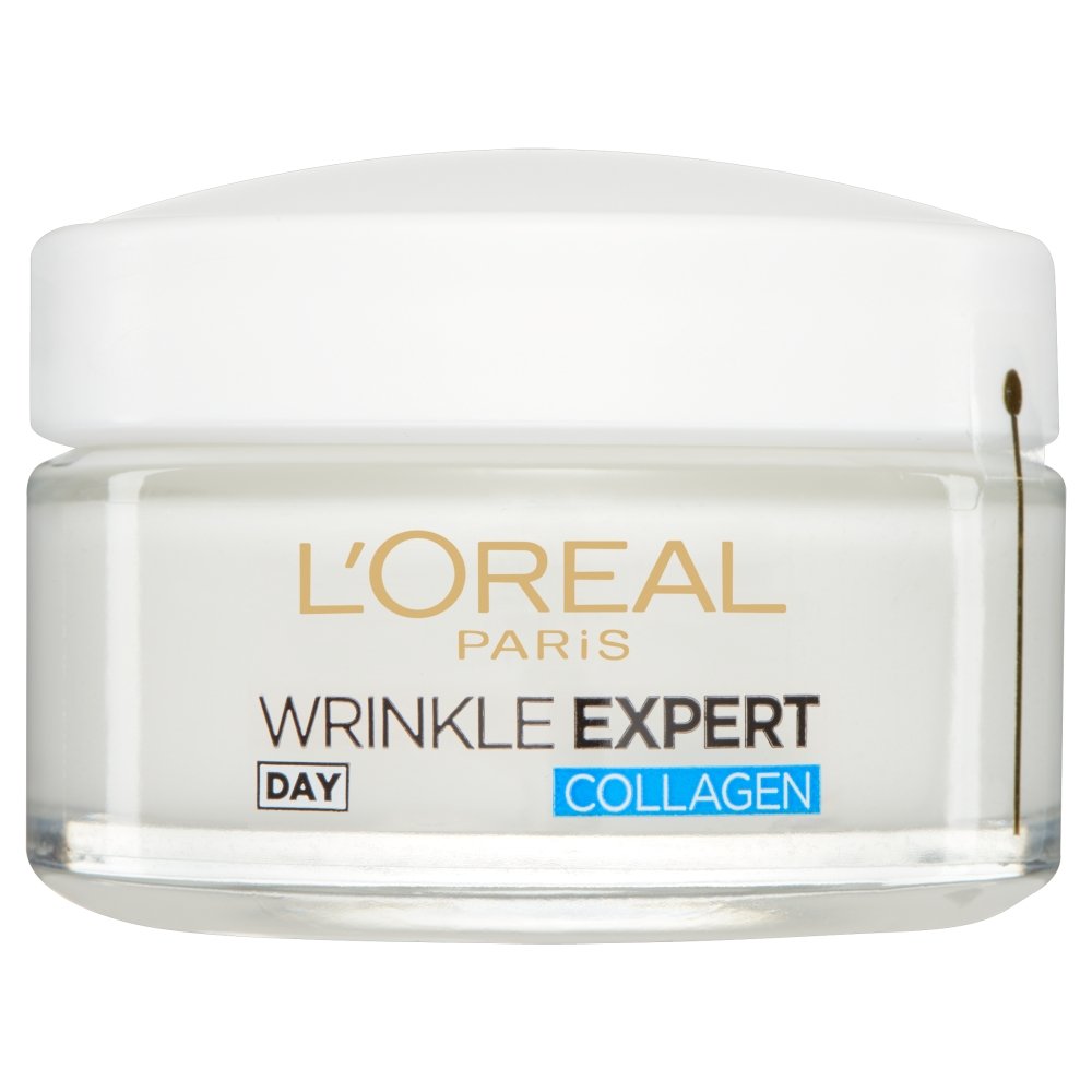 Applying L'Oreal Paris Wrinkle Expert Day Cream in a morning skincare routine