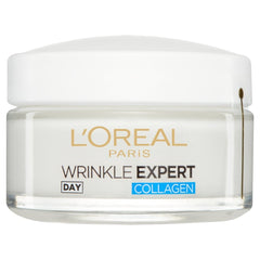 Applying L'Oreal Paris Wrinkle Expert Day Cream in a morning skincare routine
