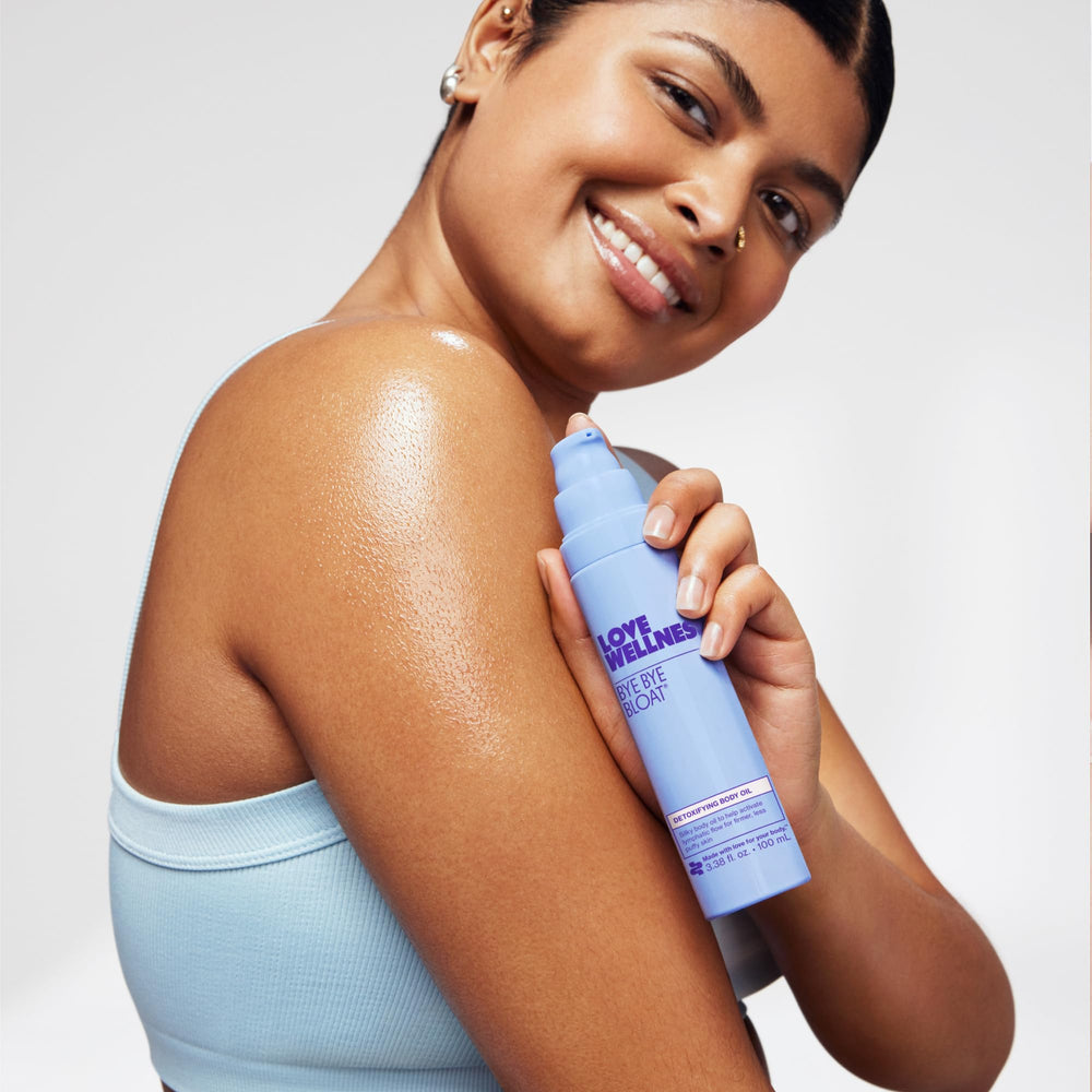 Close-up of Bye Bye Bloat oil showing a skin-friendly formula.