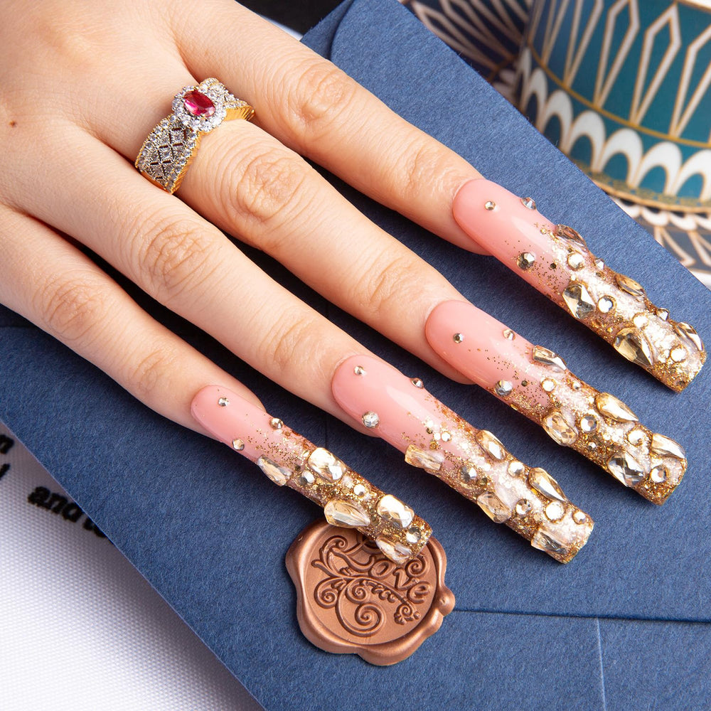 LOVFUL Gold Bling nails on hand showcasing premium salon-like finish.
