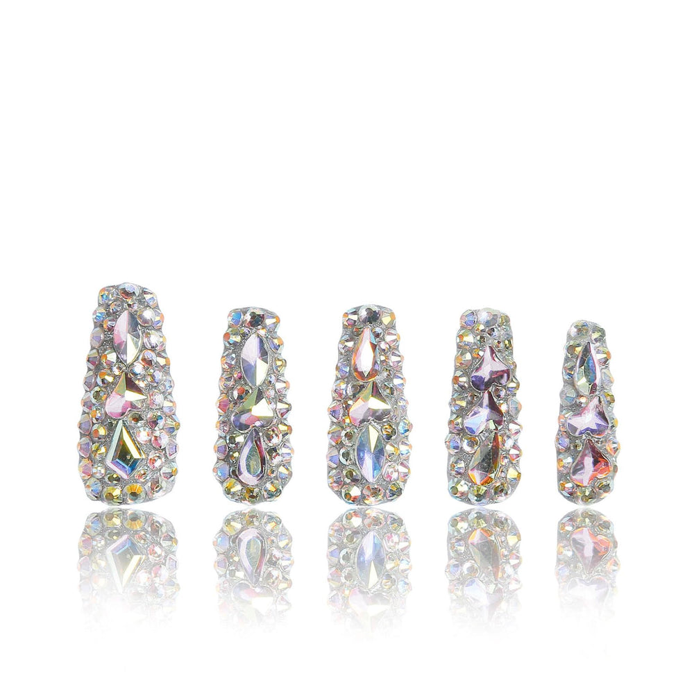 LOVFUL press-on nails with rhinestones on a hand, offering an elegant, quick at-home manicure.