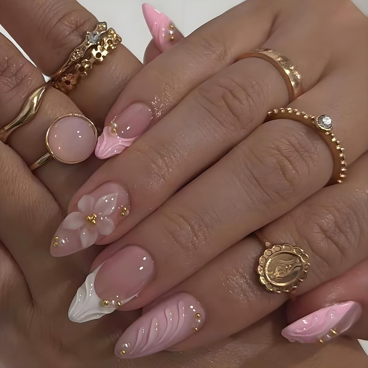 LPOODDNU embossed flowers and gold beads add texture and luxury to nails