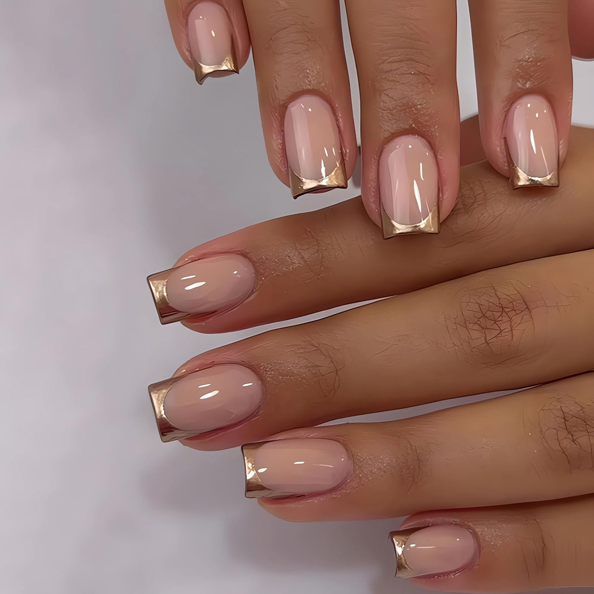 LPOODDNU gold French tip press-on nails in medium square for quick manicure.