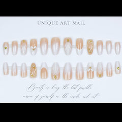 LPOODDNU almond press-on nails with white tips and gilded details.