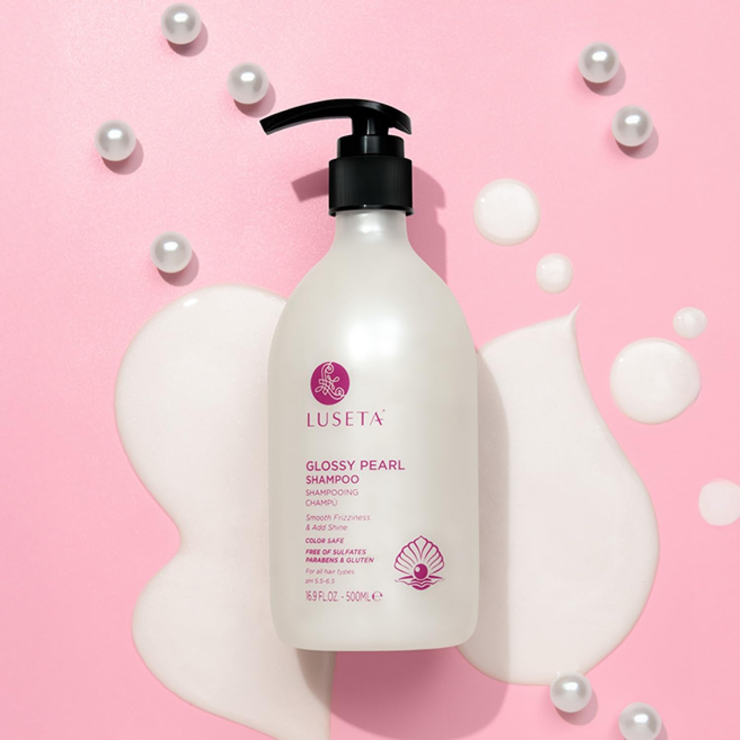 Luseta glossy pearl shampoo pearls in water illustrating luxurious luster.