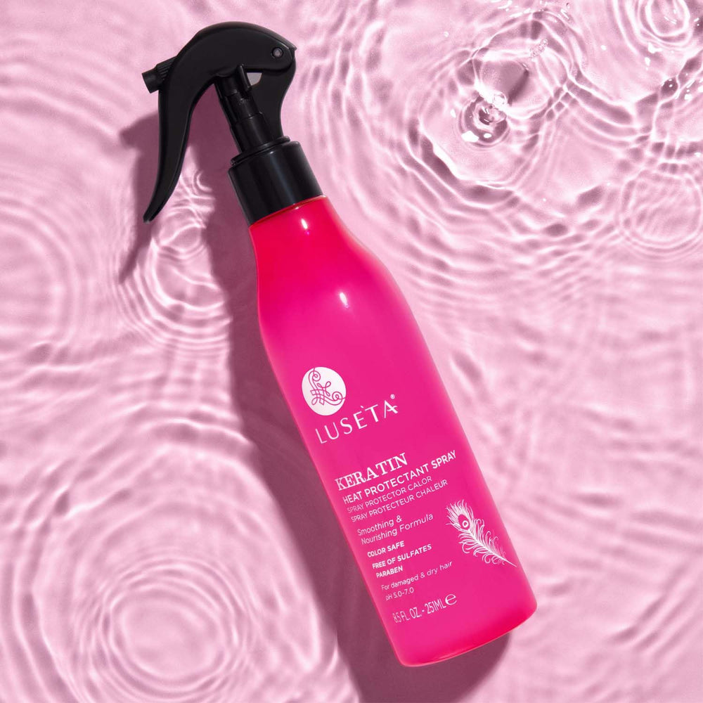 Luseta Keratin Heat Protectant spray on damp hair for even coverage.