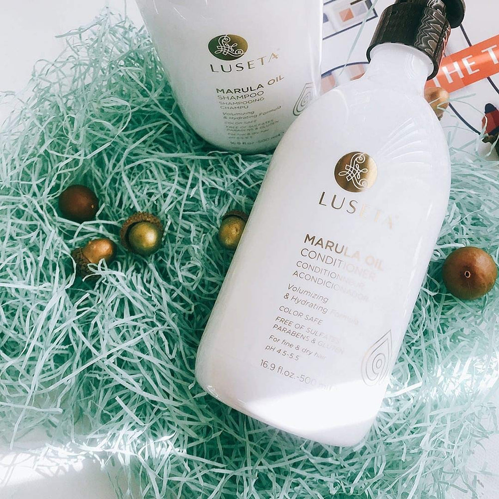 Luseta Marula Oil set flat lay with two bottles.