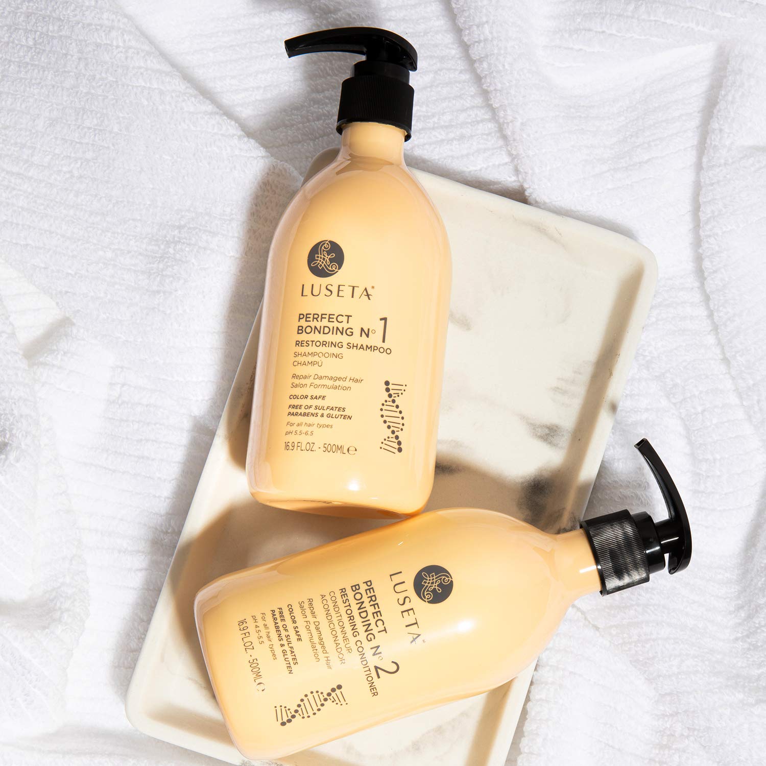 Luseta product packaging and labels, emphasizing bond restoration and color longevity.