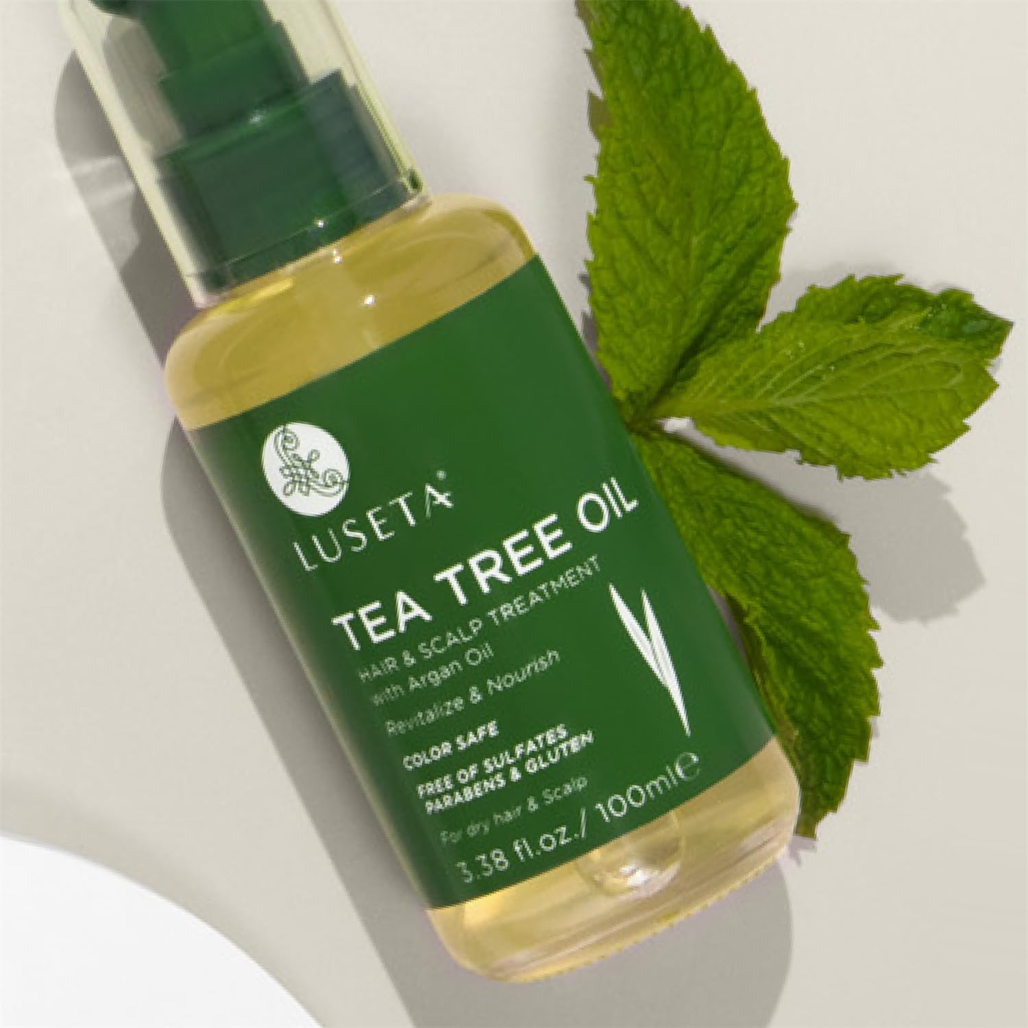 Color-safe Luseta Tea Tree Oil label highlights sulfate-free formula.