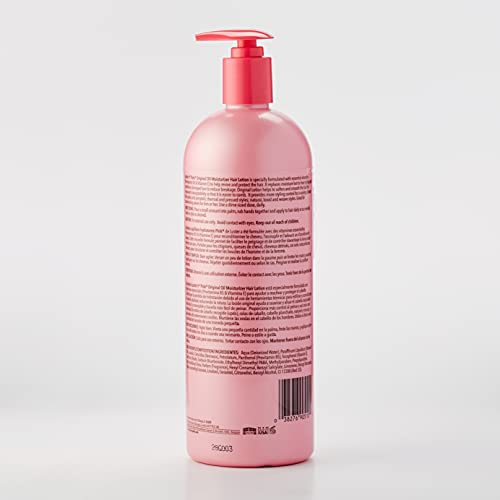 Luster's Pink Oil Moisturizer being spread by hands for even distribution.