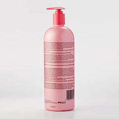 Luster's Pink Oil Moisturizer being spread by hands for even distribution.