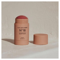 Lux Unfiltered N°18 Sunset swatch for a sun-kissed glow.