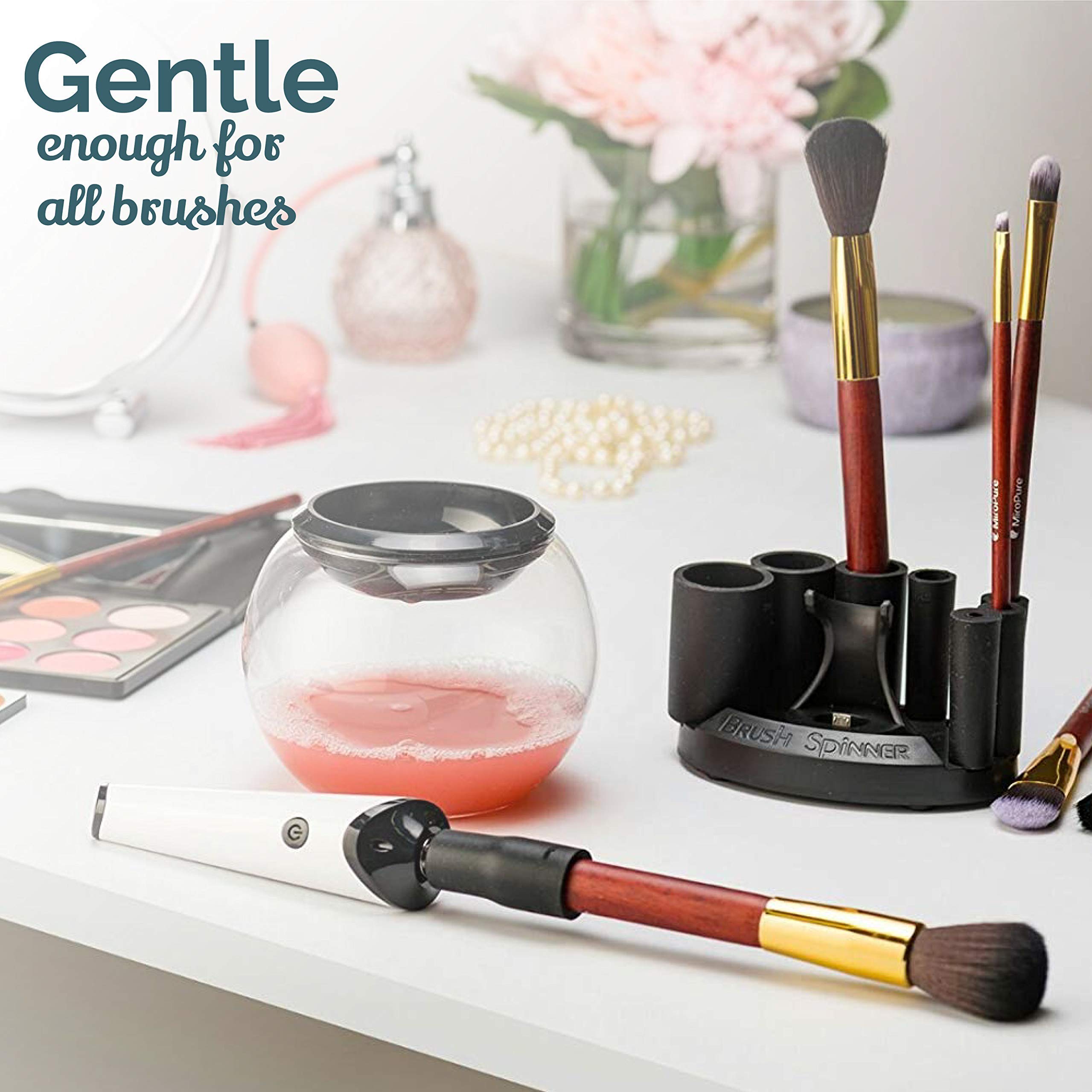 Luxe automatic makeup brush cleaner in action on a brush