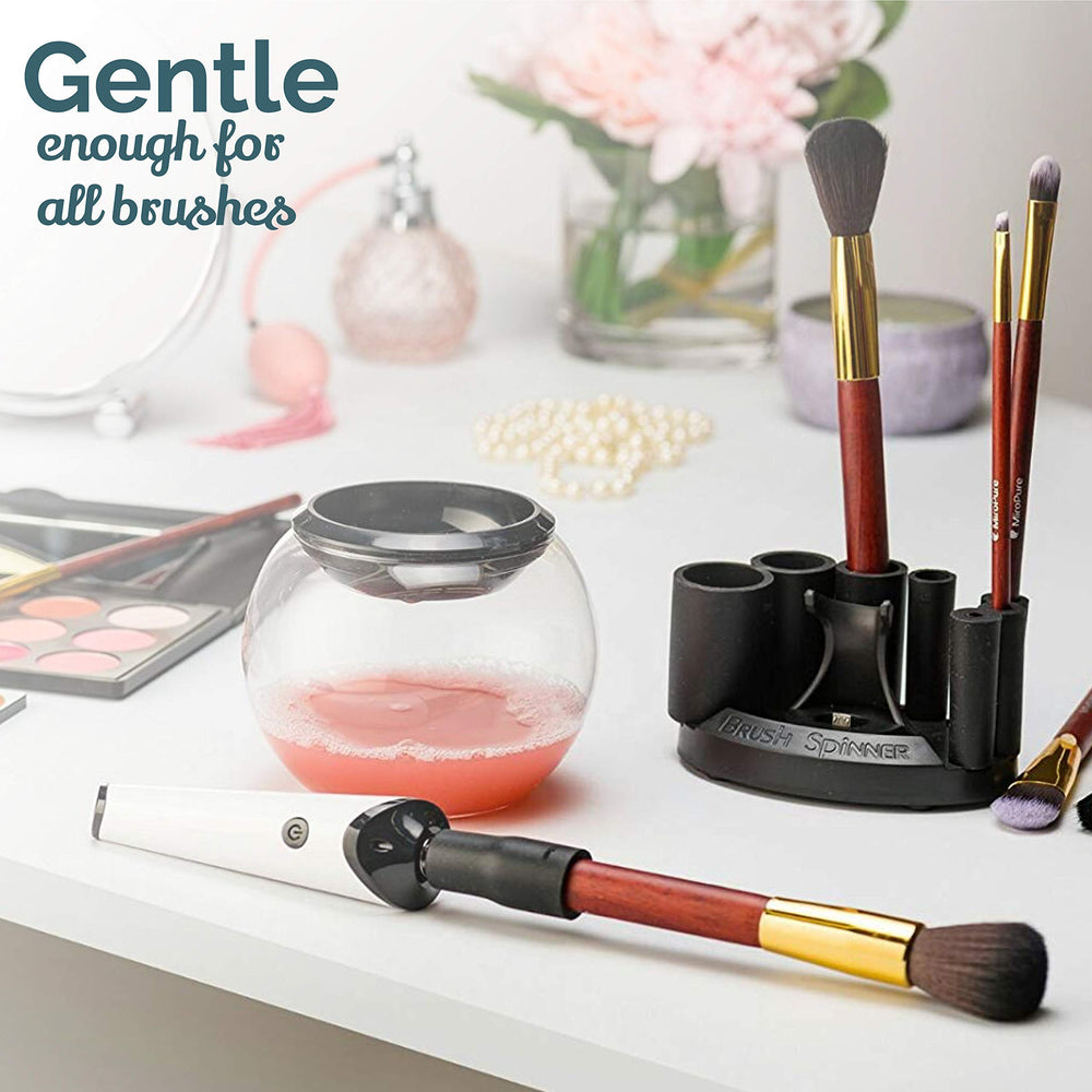 Luxe automatic makeup brush cleaner in action on a brush