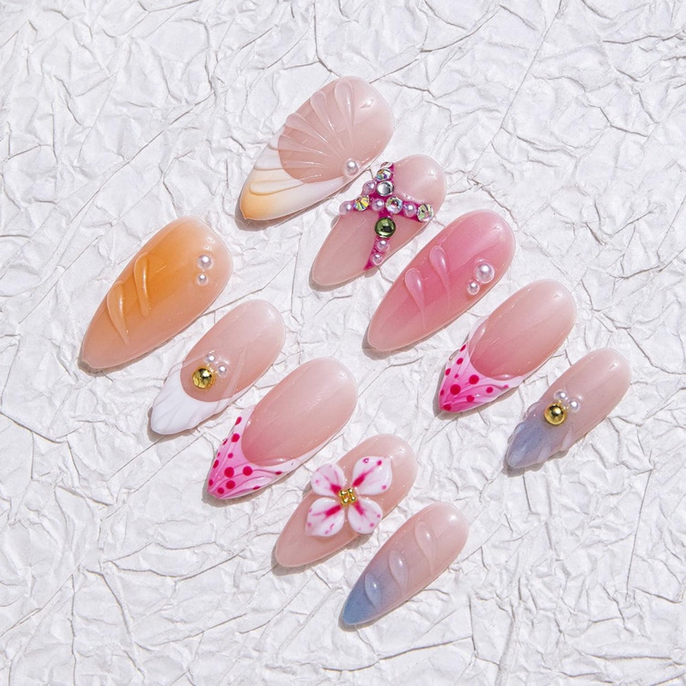 MABKJLF nails with rhinestones and petals for eye-catching party-ready style.