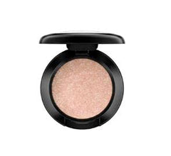 MAC Honey Lust Lustre eyeshadow in bronze-dipped peach for rich color and smooth blending.