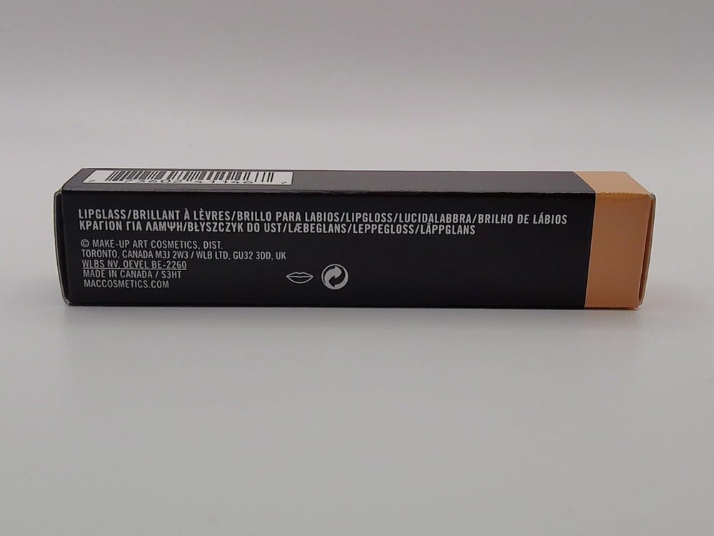 MAC Lipglass C-THRU close-up on lips highlights jojoba oil hydration.