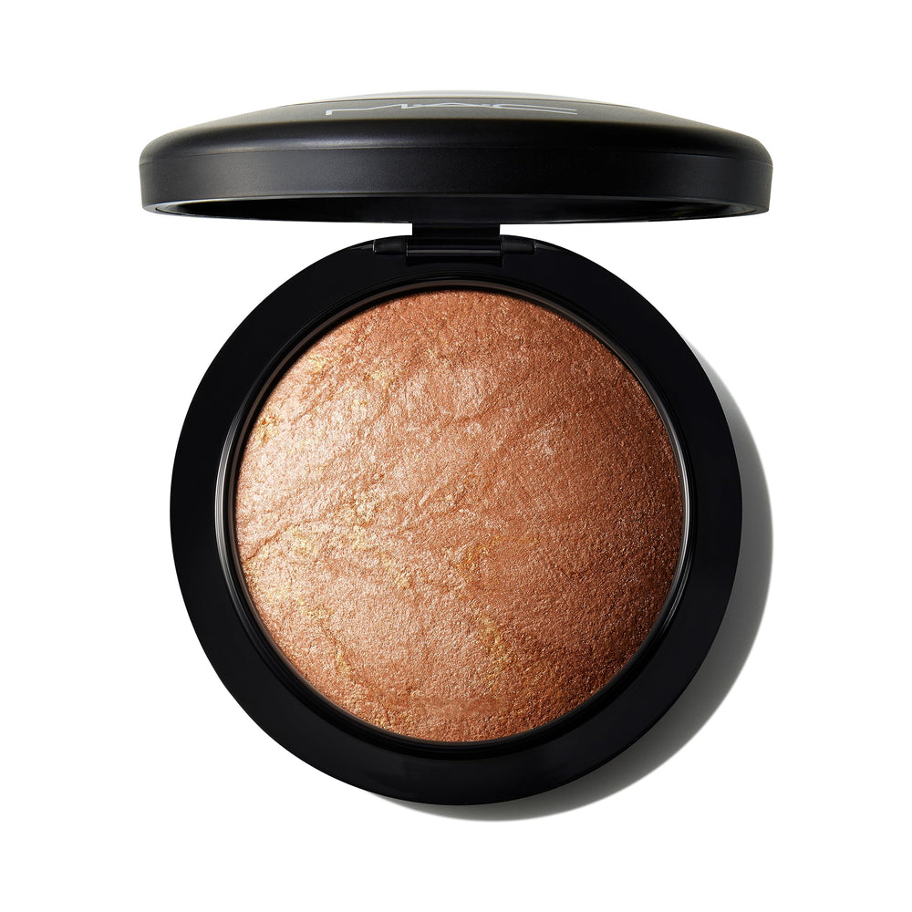 MAC Mineralize Skinfinish Global Glow compact with warm golden shimmer for radiant skin