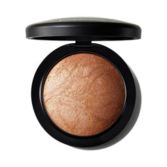 MAC Mineralize Skinfinish Global Glow compact with warm golden shimmer for radiant skin