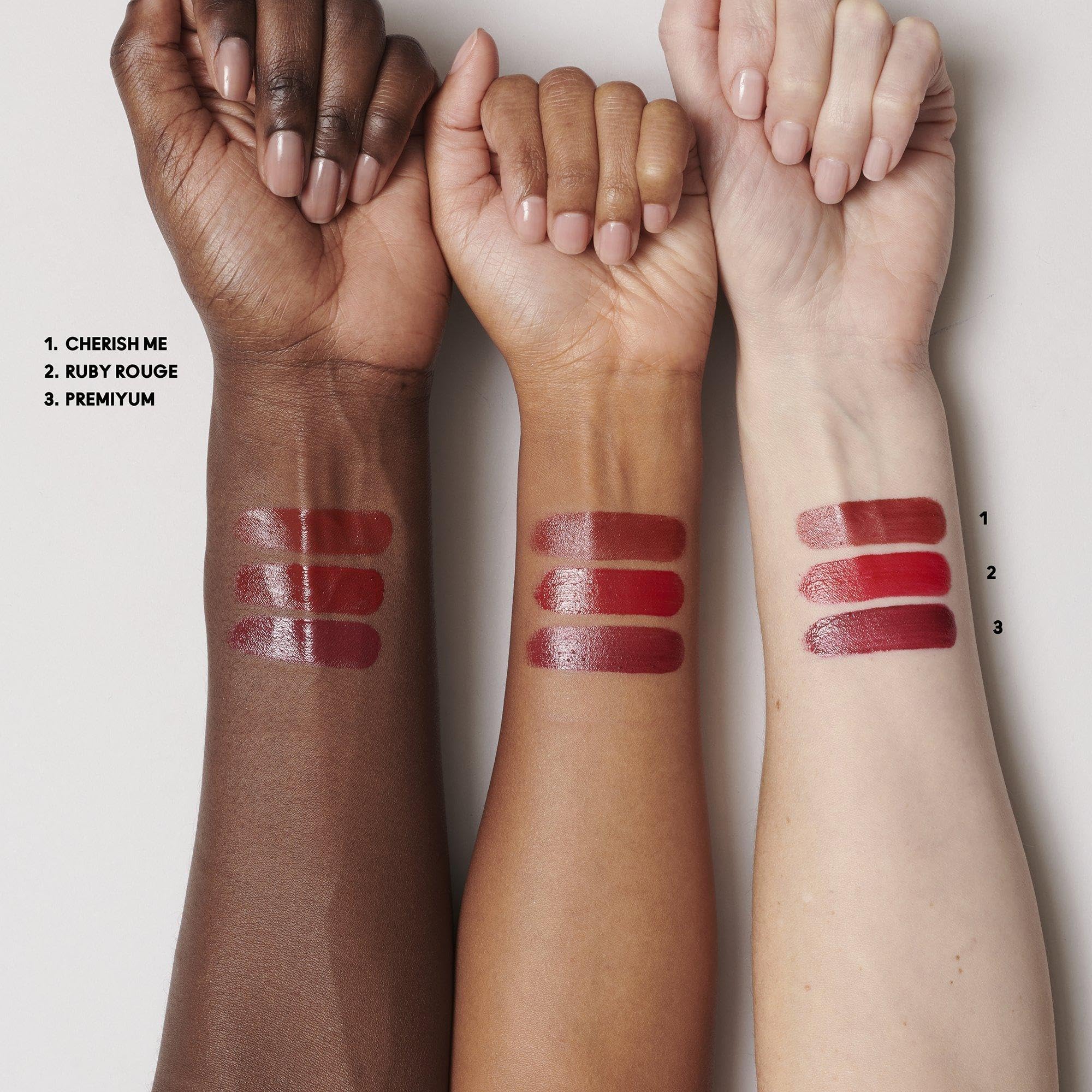 MAC Mini Lustreglass Ruby Rouge lipstick delivers sheer red glow.