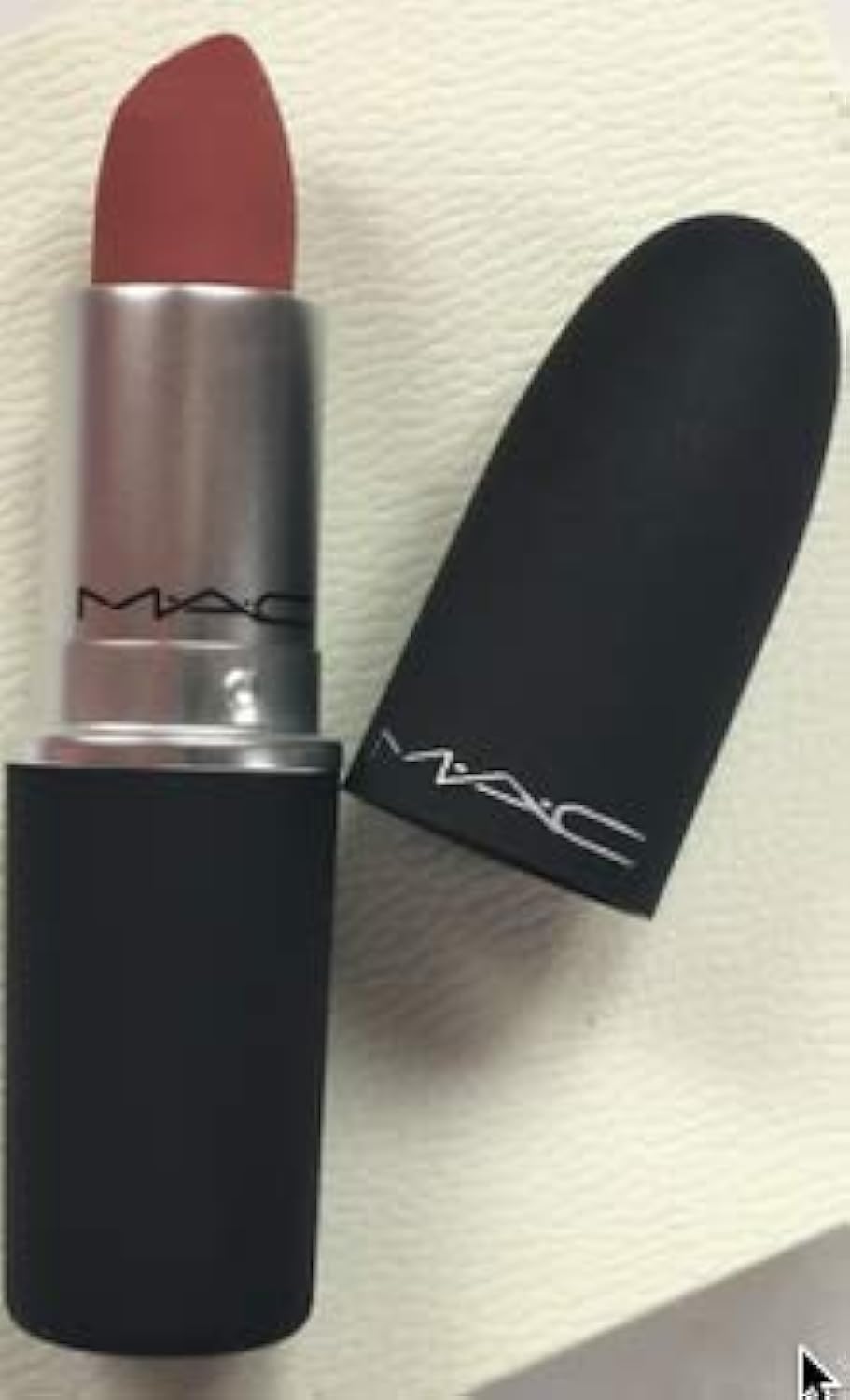 MAC Powder Kiss Lipstick Mull It Over swatch with a soft matte finish for a natural look