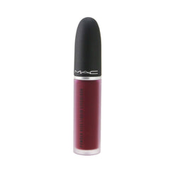 Swatch of MAC Powder Kiss Liquid Lipcolour on lips showing soft-focus matte finish.