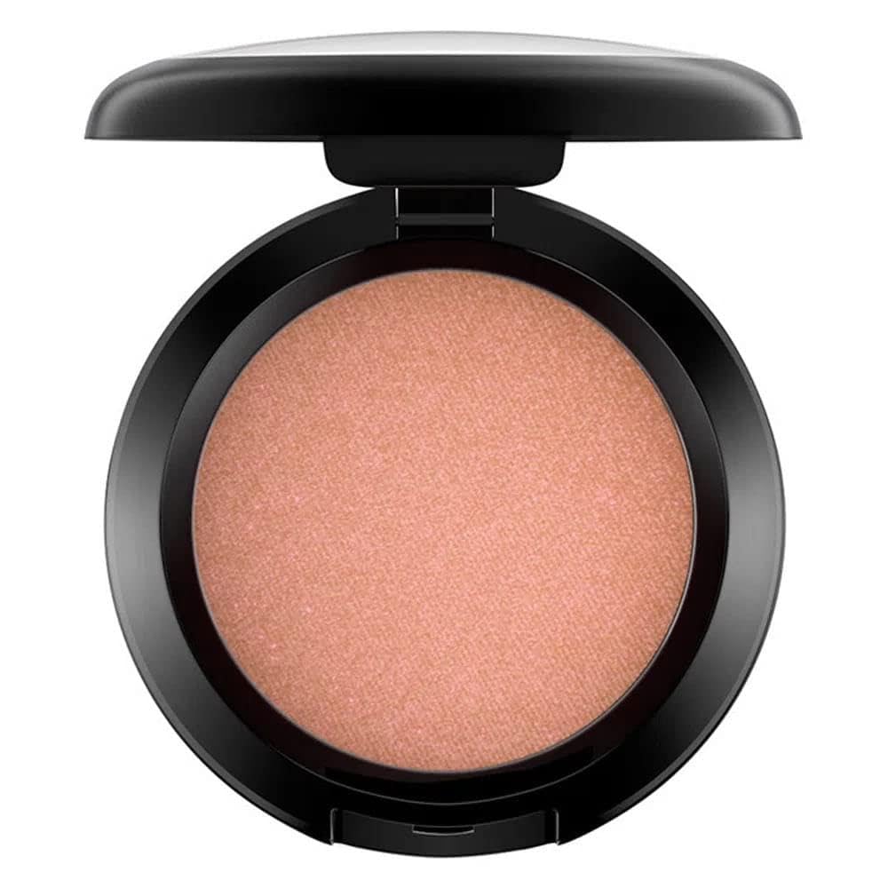 Sunbasque glow on cheeks highlights natural warmth and a healthy look.