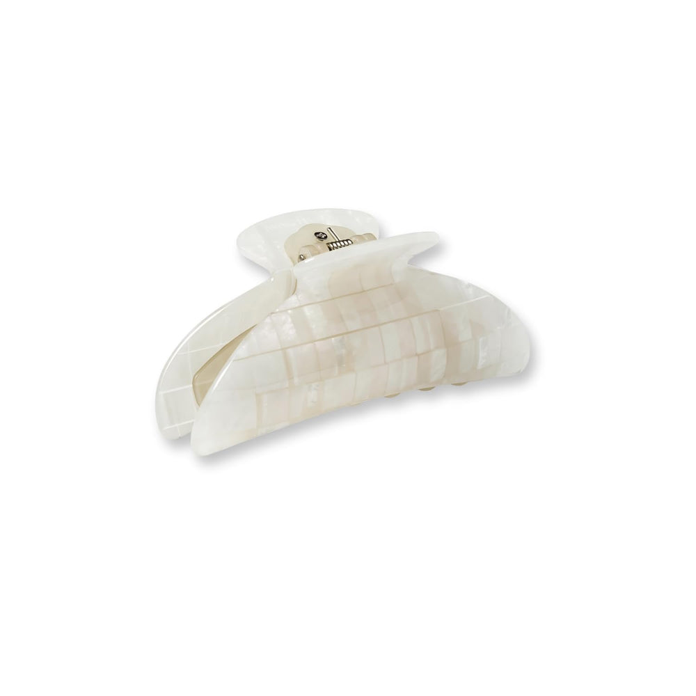 MACHETE hair clip in hand shows elegant Italian acetate craftsmanship.