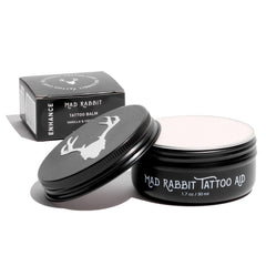 Mad Rabbit Tattoo Balm bottle for color enhancement, ready to apply.