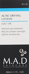 Close-up of M.A.D Skincare bottle highlighting effective spot treatment