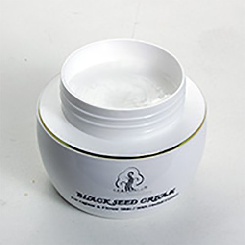 Madina Black Seed Face Cream jar presents creamy texture for easy application