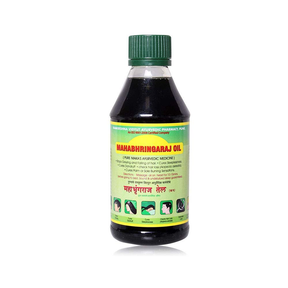 Mahabhringaraj Oil bottle pour supports night-time scalp massage for nourishment
