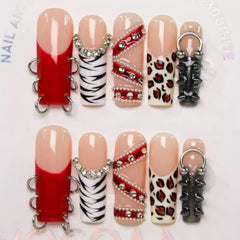 Maigitur 5D press-on nails with red French tip and leopard rhinestones.