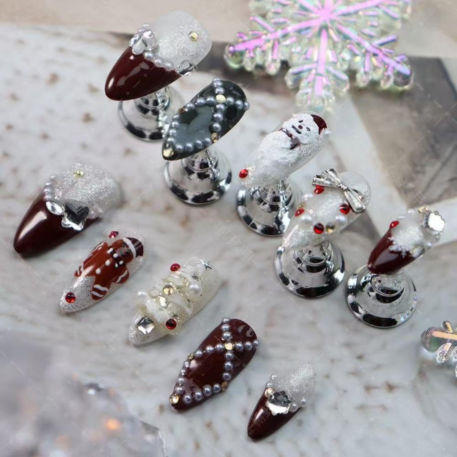 Maigitur Christmas nails with snowman design and dark red almond tips for a festive look.
