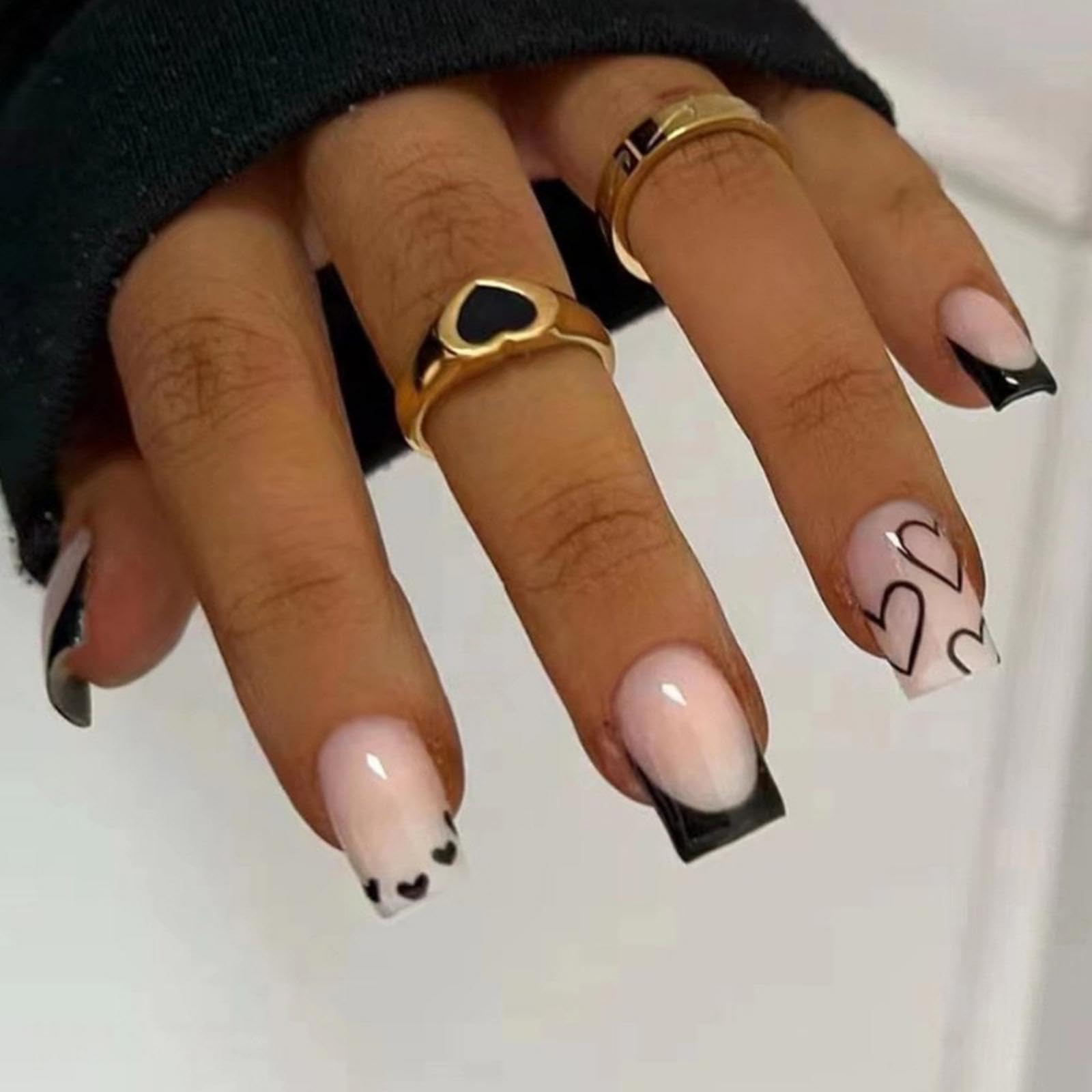 Maigitur French Tip press-on nails with black base and white heart design for effortless V-day style