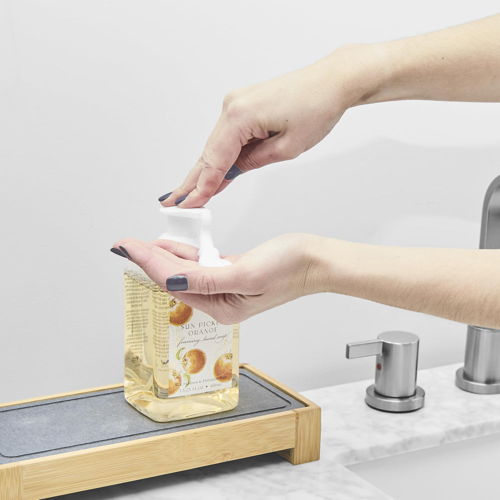 MAISON DE BASE Bathroom counter display with four bottles