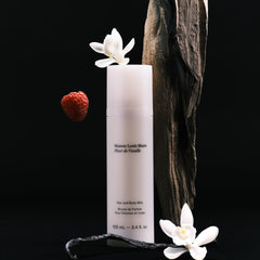 Close-up of Fleur de Vanille mist spray nozzle releasing a delicate scent.
