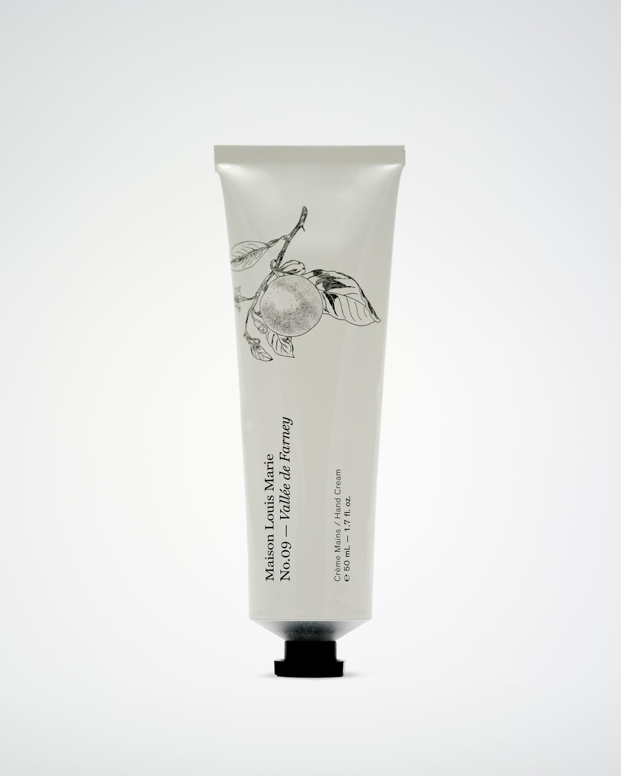Close-up of Maison Louis Marie hand cream texture showing quick absorption.