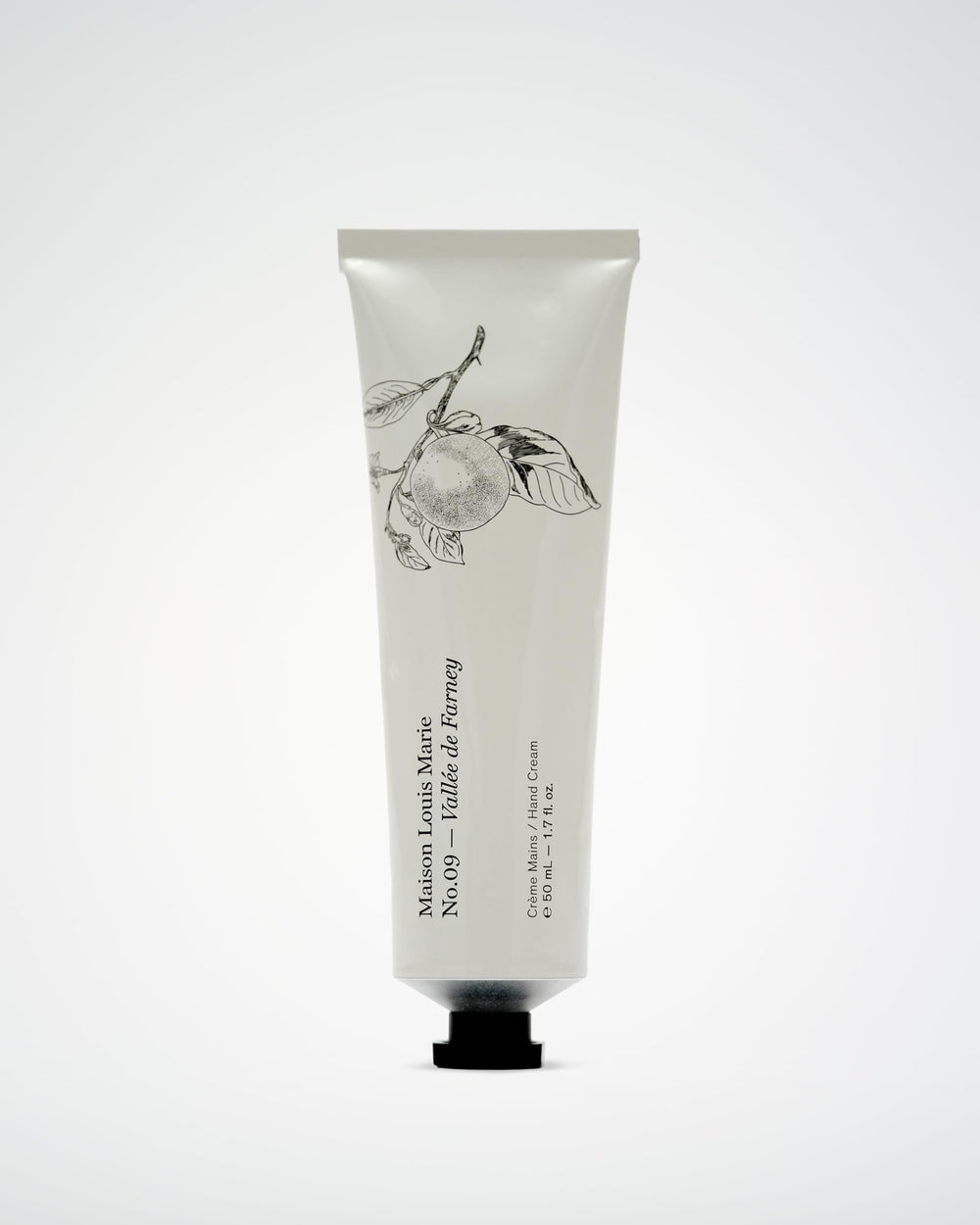 Close-up of Maison Louis Marie hand cream texture showing quick absorption.